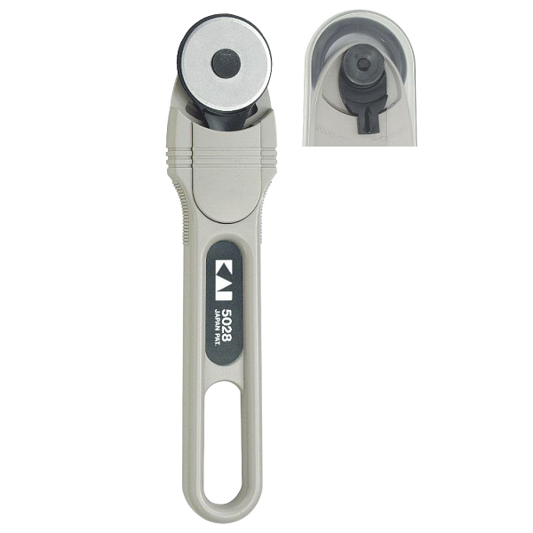 Handheld rotary blade cutter for carbon and fiberglass prepregs.